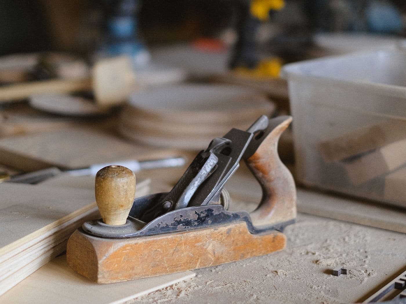 Seasoned wooden planks and hand tools at the Rishabh Furniture workshop